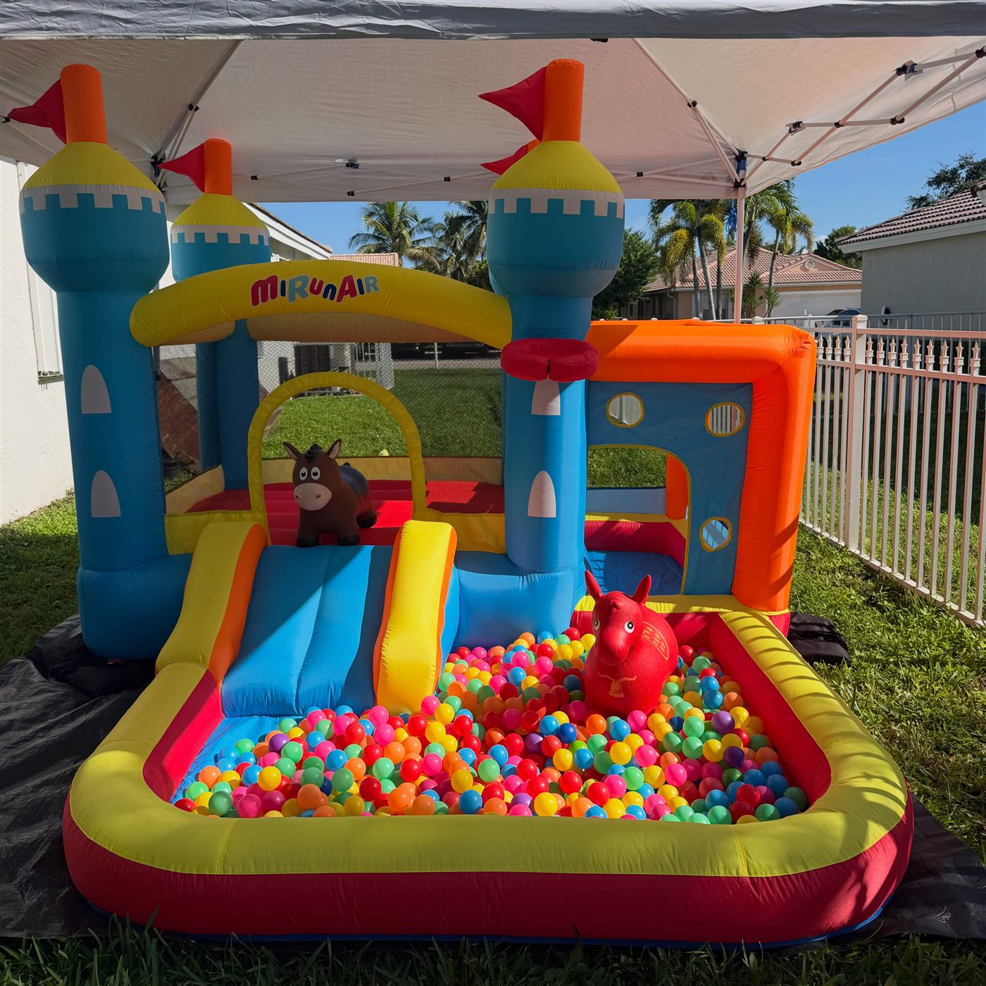 Toddler castle bounce house and colorful ball pit